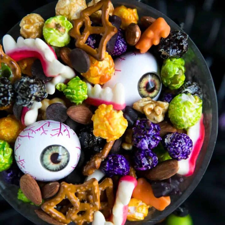 A bowl of Halloween monster mash party mix prepared after reading these Halloween starters