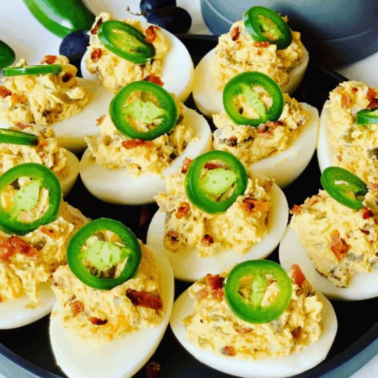A tray of Jalapeno popper deviled eggs prepared after reading these summer appetizer recipes
