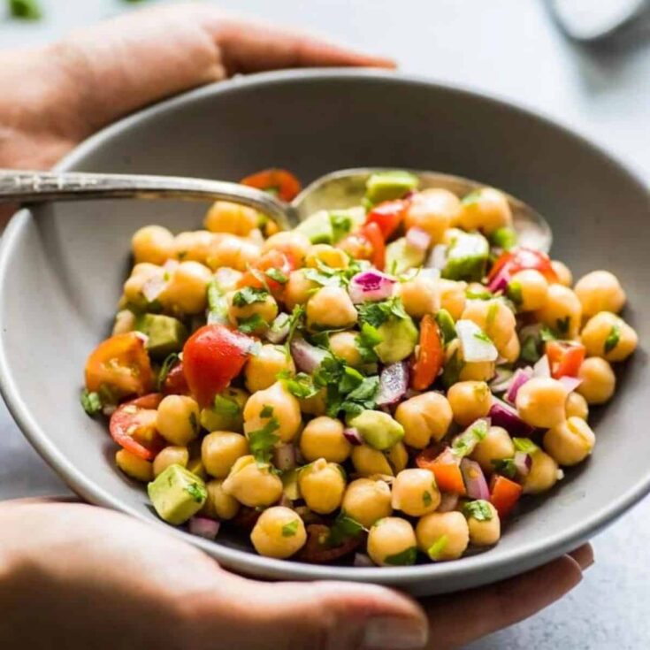 A bowl of Mexican chickpea salad cooked after reading these Picnic food ideas