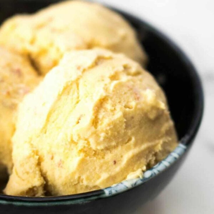 A bowl of peach homemade ice cream