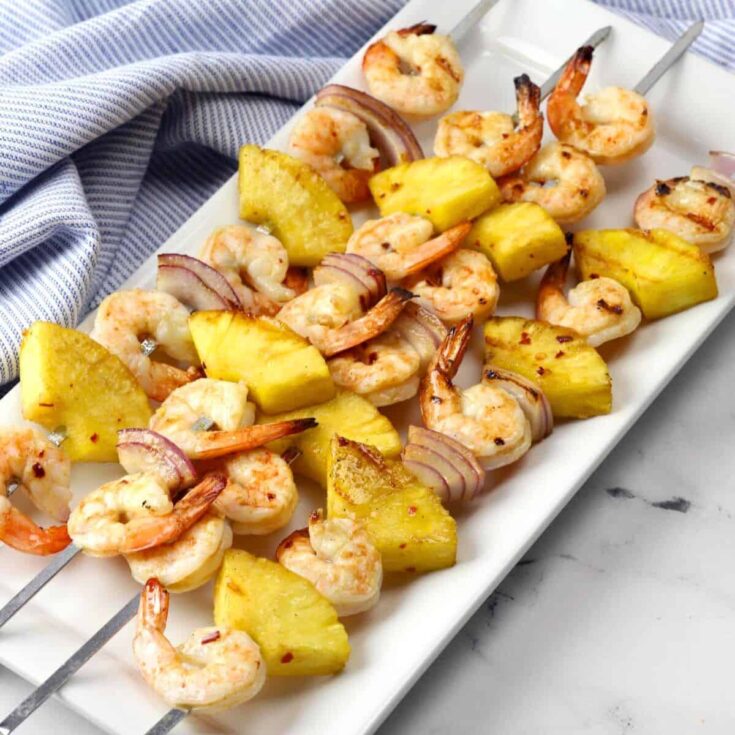 Pineapple shrimp skewers cooked after reading these Summer grilling recipes