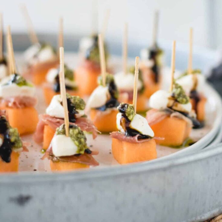 A tray of Prosciutto melon skewers summer appetizers