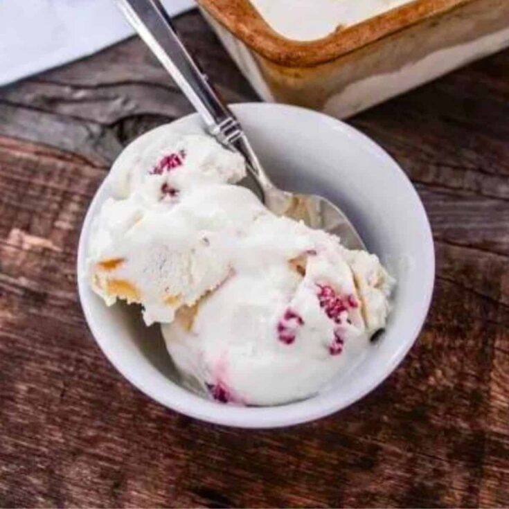 A bowl of raspberry and peach no churn homemade ice cream
