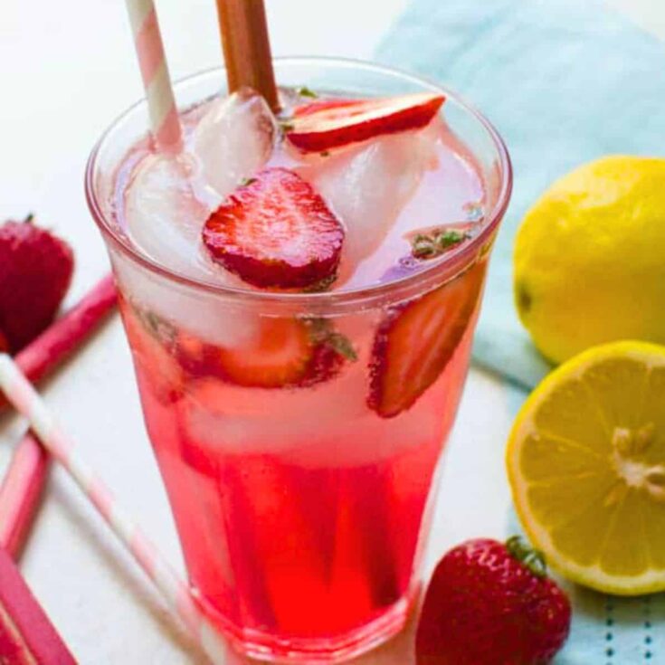 A glass of sparkling rhubarb ginger lemonade prepared after reading these summer mocktails