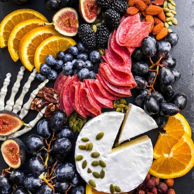 Spooky Halloween charcuterie board prepared after reading these Halloween starters