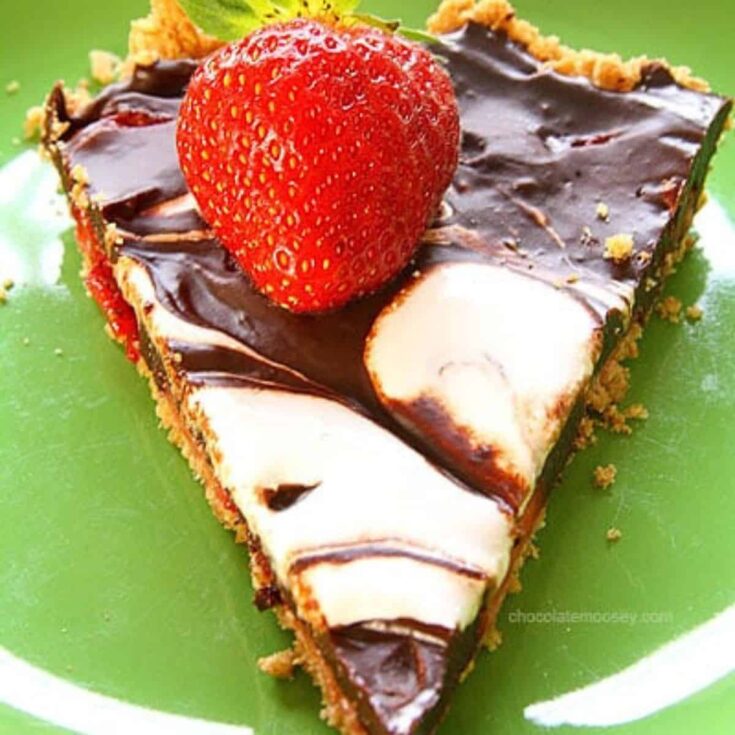 A slice of strawberry s'mores tart prepared after reading these s'mores recipes