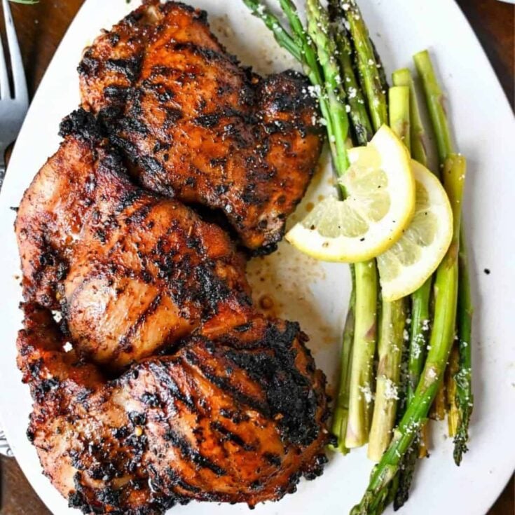 Sweet and spicy grilled chicken thighs cooked after reading these Summer grilling recipes