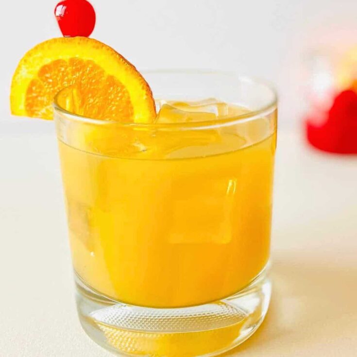 A glass of whiskey sour mocktail prepared after reading these summer mocktails