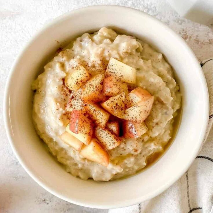 A bowl of apple pie porridge prepared after reading these Fall breakfast ideas