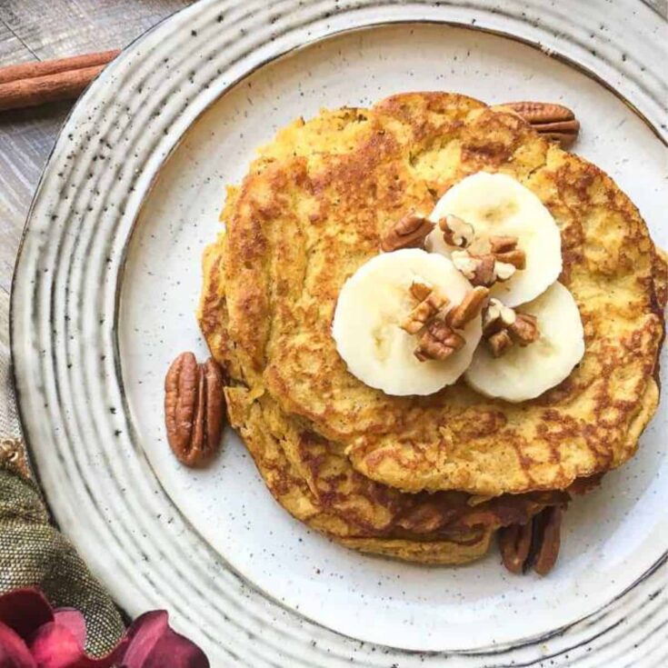 A plate of banana pumpkin spice pancakes prepared after reading these Fall breakfast ideas