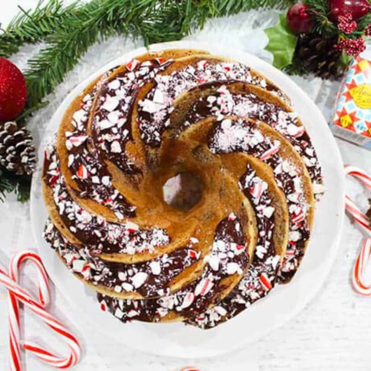 Chocolate peppermint marble cake, topped with peppermint candy crushes, baked after reading these Christmas Bundt cake recipe