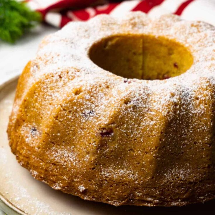 A whole bundt cake topped with powdered sugar, baked after reading these Christmas Bundt cake recipe