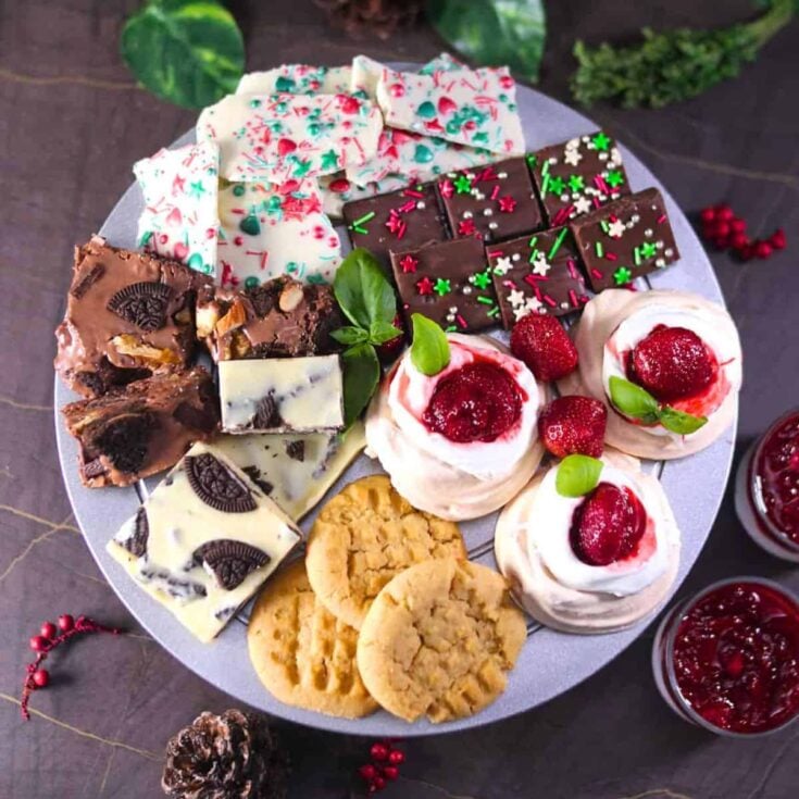A board filled with chocolates, Oreo desserts, and more, prepared after reading these Christmas charcuterie board