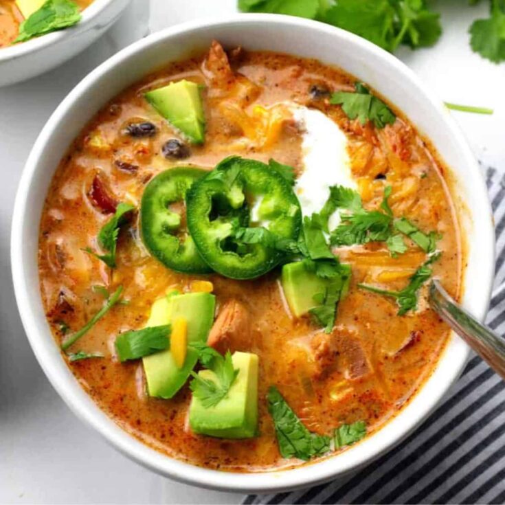 A bowl of creamy chicken enchilada soup cooked after reading these Comfort food recipes