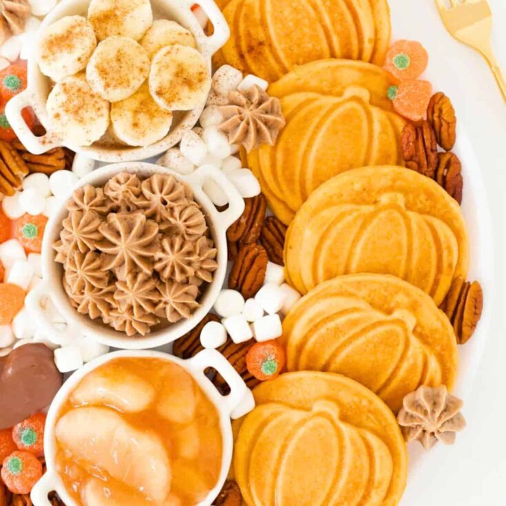 Fall brunch board with pumpkin shaped waffles prepared after reading these Fall breakfast ideas