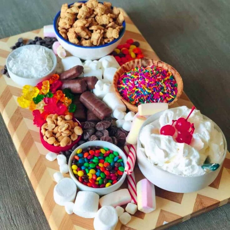 An ice cream sundae Valentines charcuterie board with marshmallows, sprinkles, and more