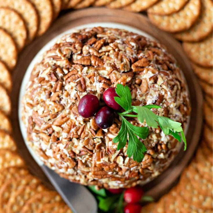 Pineapple cheese ball surrounded by biscuits, prepared after reading these Christmas appetizers
