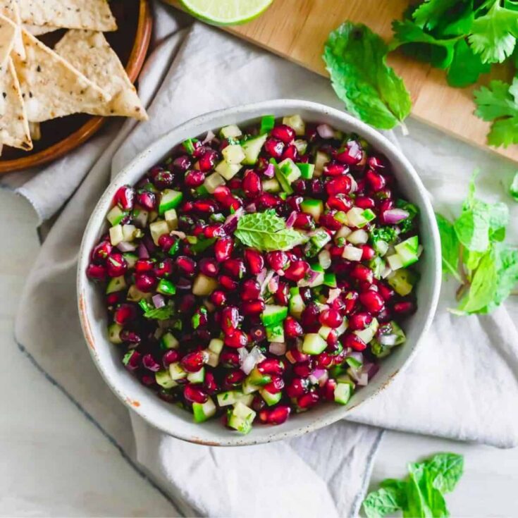 A bowl of pomegranate salsa prepared after reading these Christmas appetizers