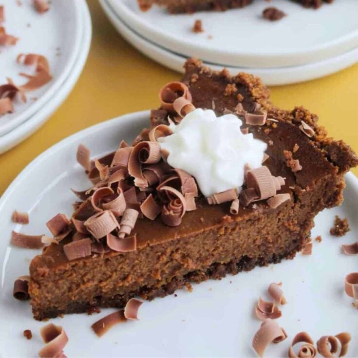 A slice of pumpkin chocolate pie baked after reading these Chocolate Thanksgiving Desserts