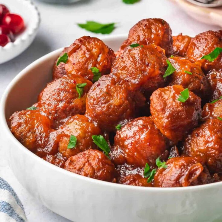 A bowl of slow cooker cranberry meatballs prepared after reading these Christmas appetizers