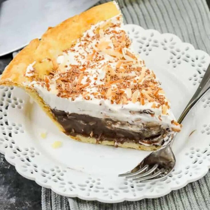 A slice of chocolate coconut cream pie baked after reading these Chocolate Thanksgiving Desserts