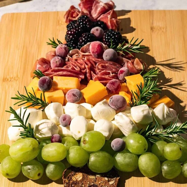 A tree shaped charcuterie board prepared after reading these Christmas charcuterie board