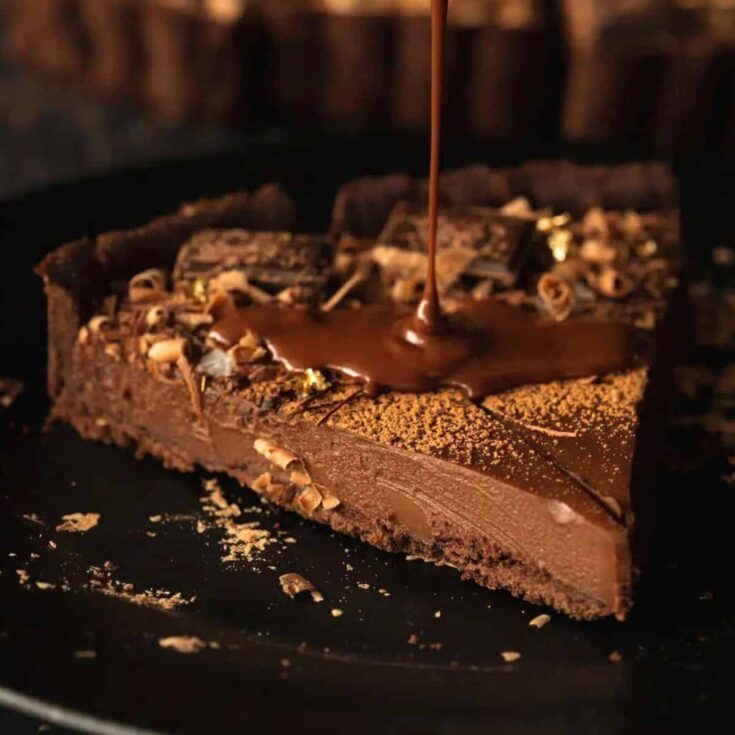 A slice of vegan chocolate tart baked after reading these Chocolate Thanksgiving Desserts