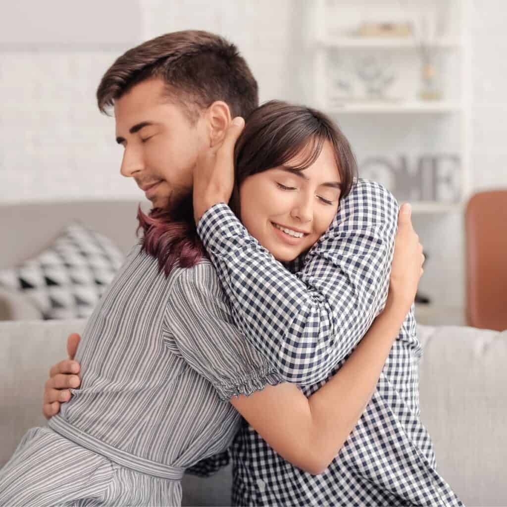 A couple hugging each other after reading these 10 tips for a happy marriage