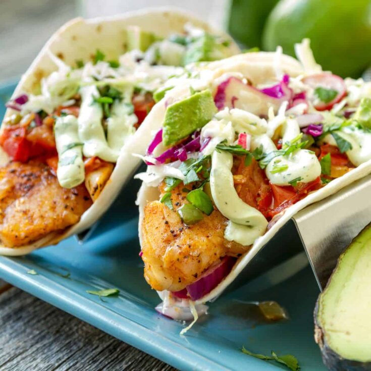 Two Baja style fish tacos prepared after reading these Taco Tuesday recipes