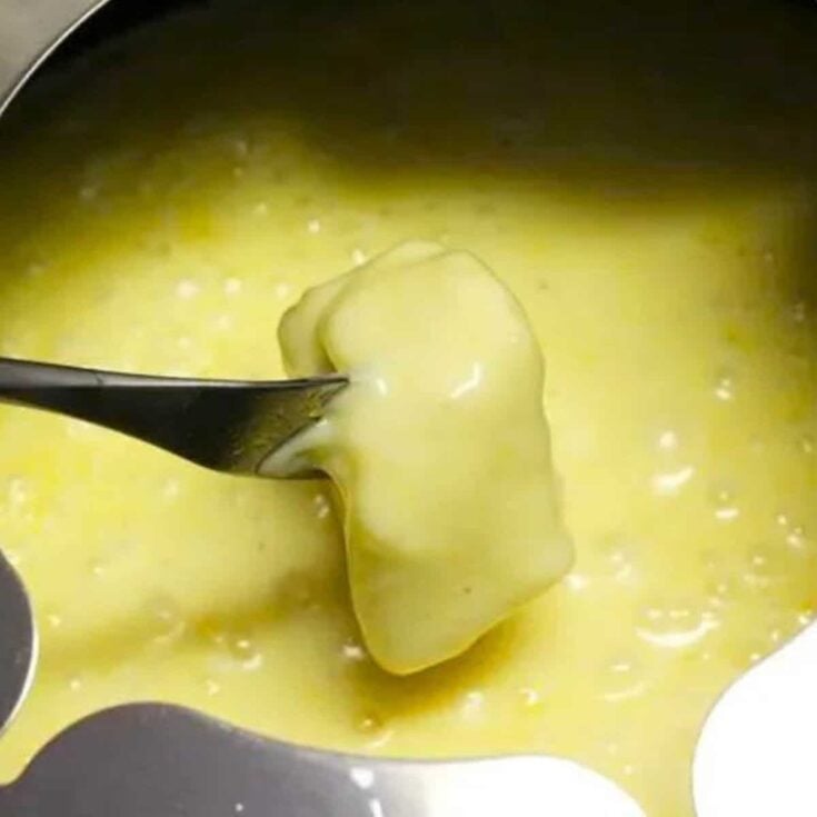 A bowl of cheddar cheese fondue made after reading these Easy fondue recipes