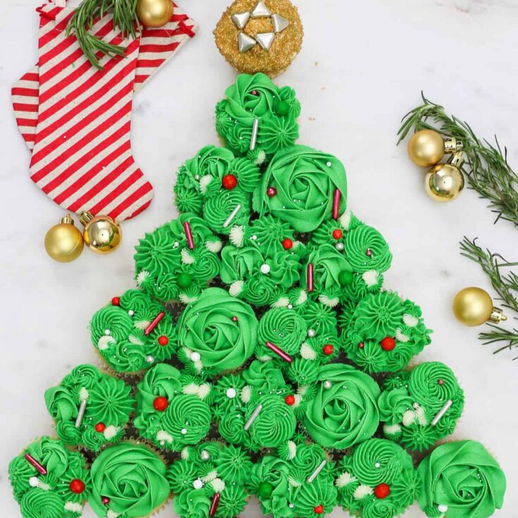 Christmas tree cake made with cupcakes with green icing, baked after reading these Christmas cake recipes