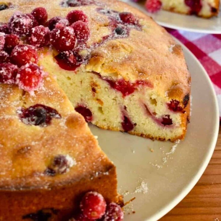 Sliced cranberry ricotta cake baked after reading these Christmas cake recipes