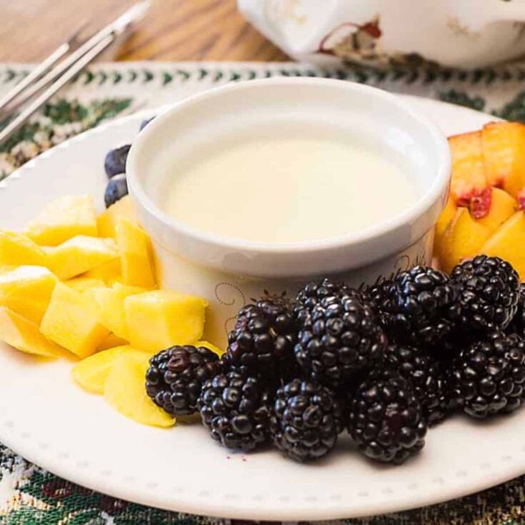 Custardy cr&egrave;me Anglaise fondue surrounded by fruits after reading these Easy fondue recipes