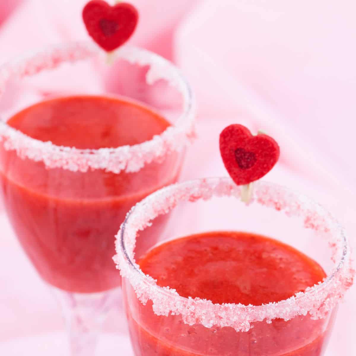 A watermelon shake with small hearts on top prepared after reading these non-alcoholic pink drinks for Valentine's Day