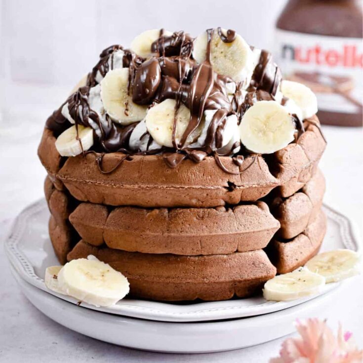 Nutella waffles topped with bananas and nutella spread, made after reading these Wonderful waffle recipes