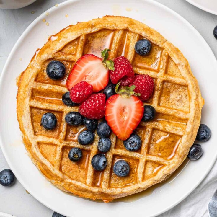 Protein waffles topped with blueberries, strawberries, and raspberries, made after reading these Wonderful waffle recipes