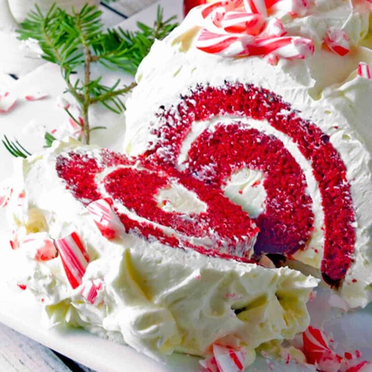 Red velvet cake roll topped with candy canes, baked after reading these Christmas cake recipes