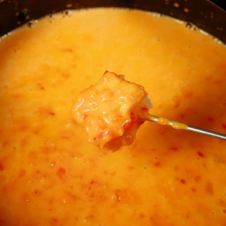 A bread dipped on a Southwest fondue after reading these Easy fondue recipes
