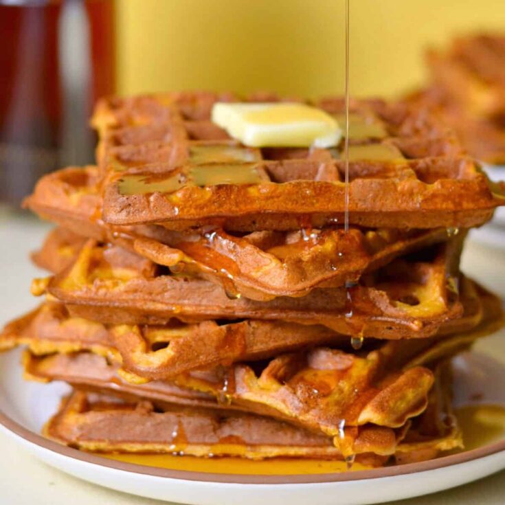 Sweet potato waffles topped with maple syrup, made after reading these Wonderful waffle recipes