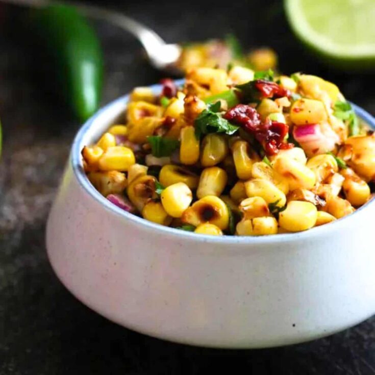 A bowl of chipotle corn salsa made after reading these Mexican appetizers for Cinco de Mayo