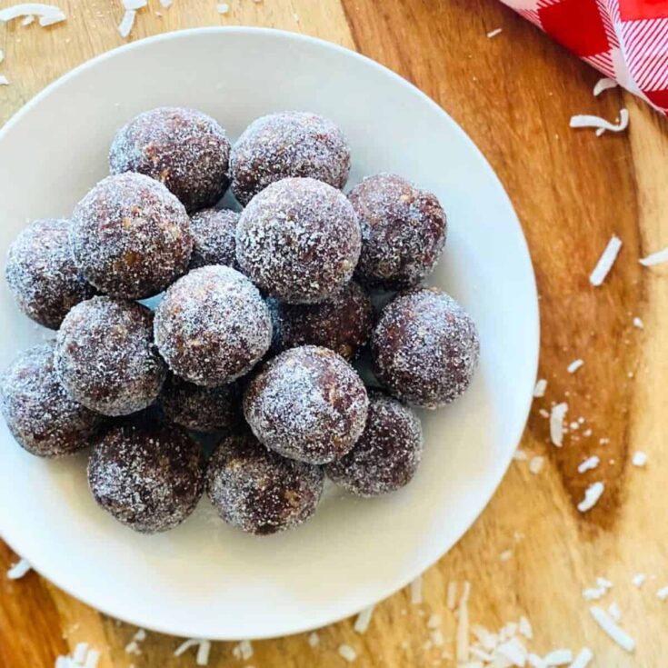 A plate of coconut rum balls made after reading these Christmas truffle ideas