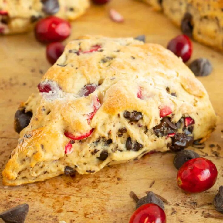 A slice of cranberry dark chocolate cake scones made after reading these Christmas breakfast ideas