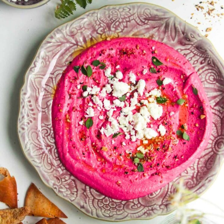 A plate of creamy beetroot feta dip made after reading these Valentines appetizers