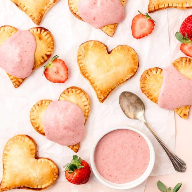 Heart shaped strawberry hand pies baked after reading these Valentines Day Desserts