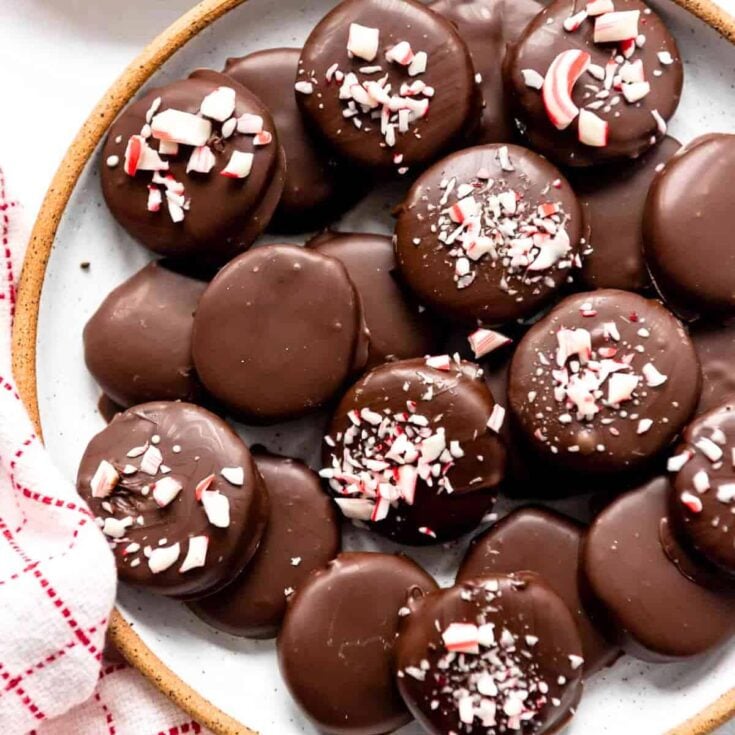 A plate filled with homemade peppermint patties made after reading these Christmas treats
