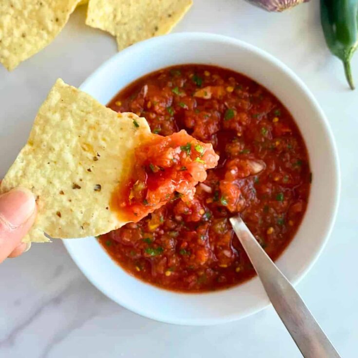 A bowl of jalapeno salsa made after reading these Mexican appetizers for Cinco de Mayo