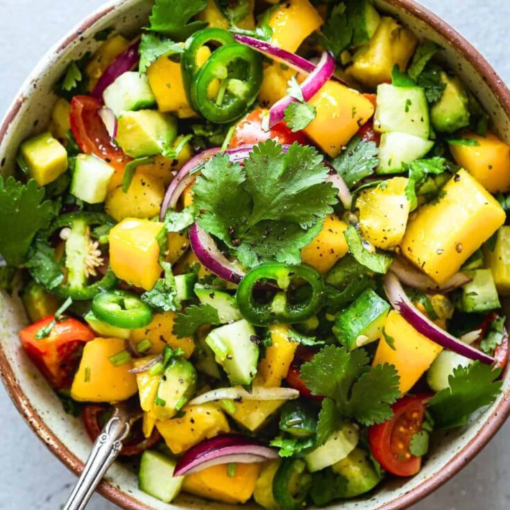 A bowl of mango avocado salsa made after reading these Mexican appetizers for Cinco de Mayo