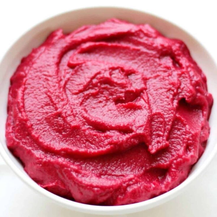 A bowl of pickled beetroot hummus made after reading these Valentines appetizers