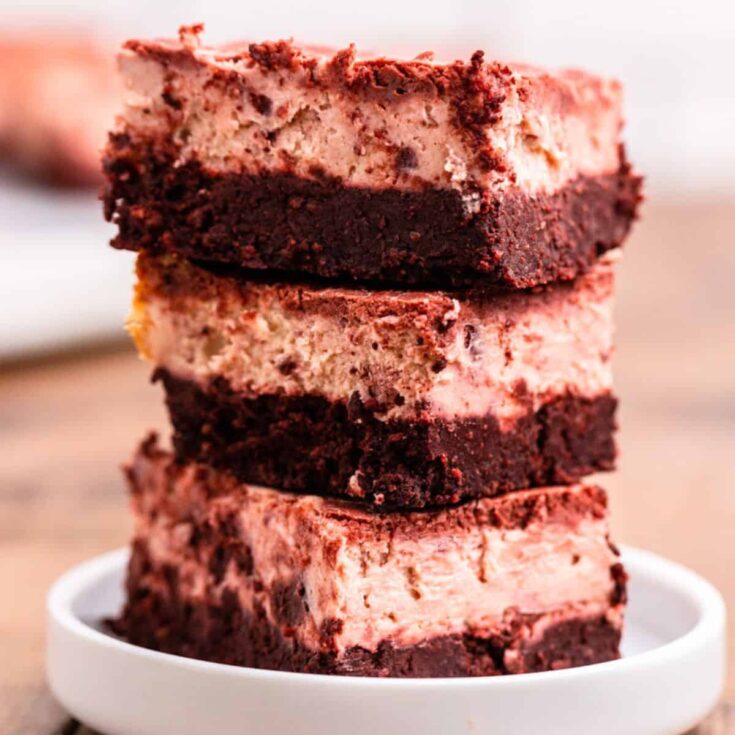 A stack of red velvet cheesecake keto brownies made after reading these Valentines Day Desserts