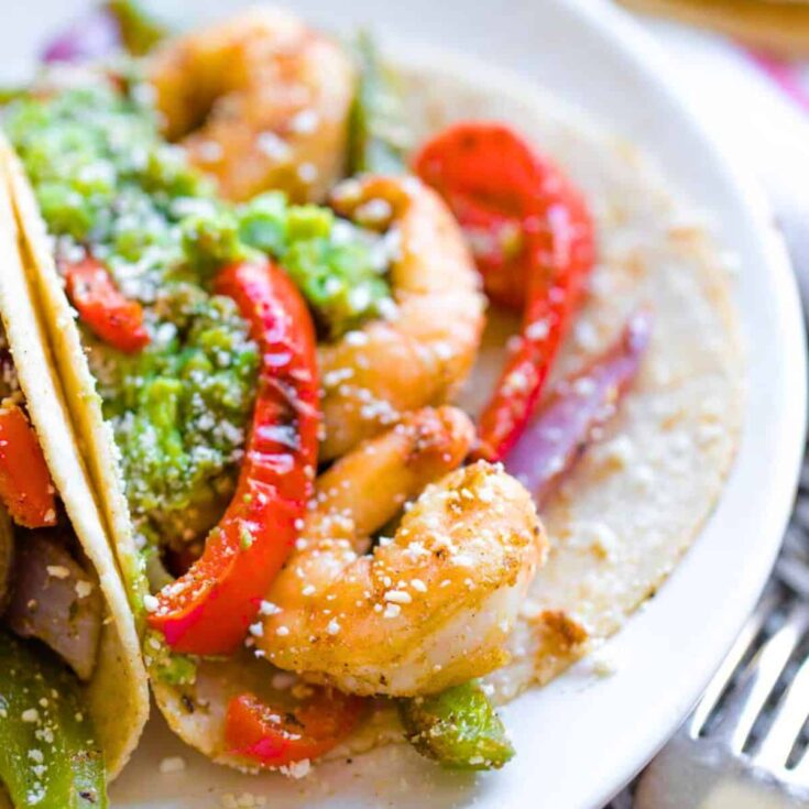 A plate of sheet pan shrimp fajitas made after reading these Cinco de Mayo dinner recipes